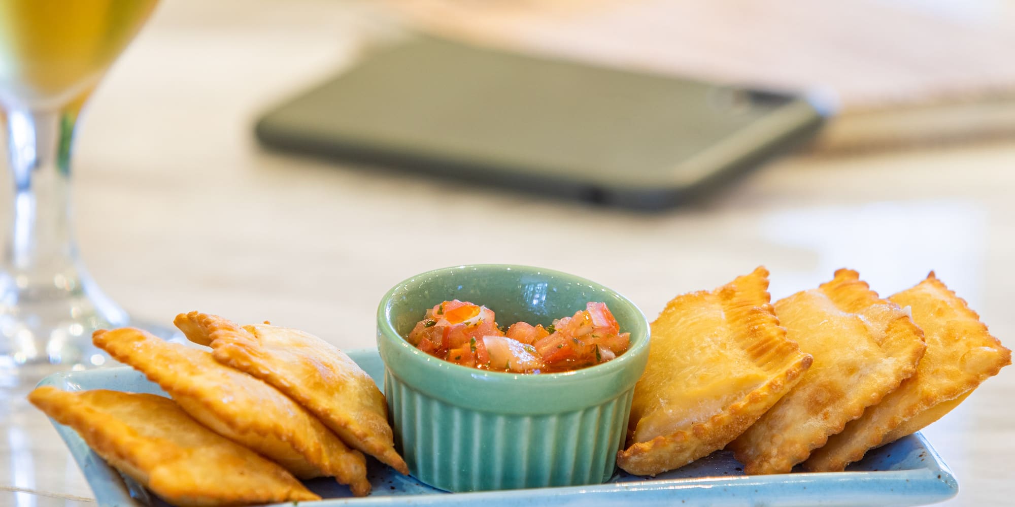 a plate of food and a glass of beer