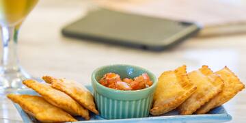 a plate of food and a glass of beer