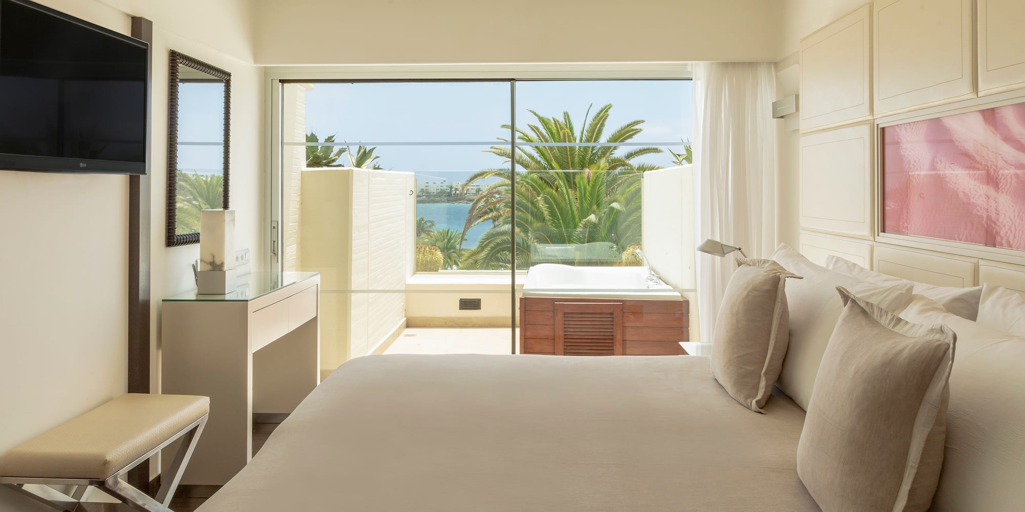 a bedroom with a large window