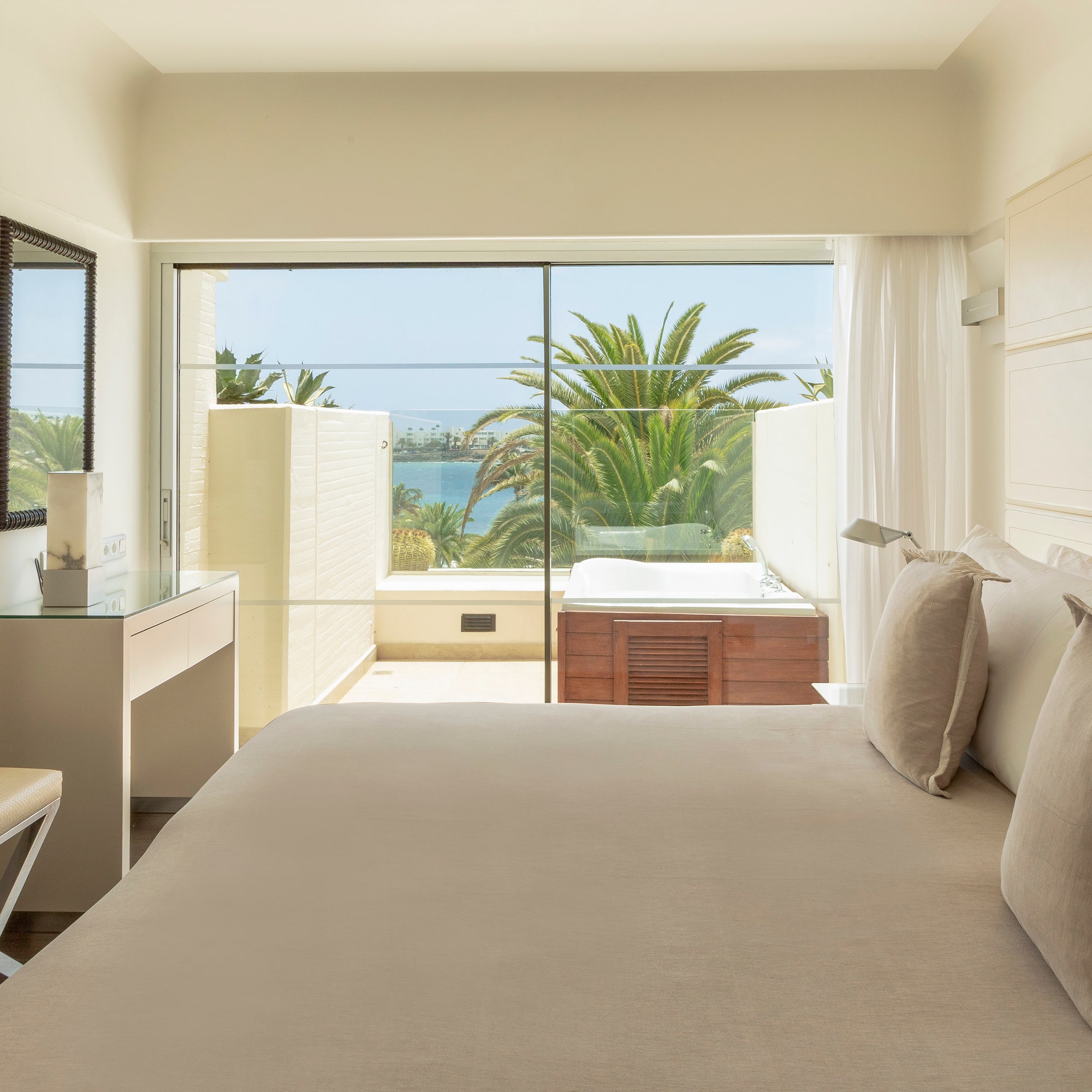 a bedroom with a large window