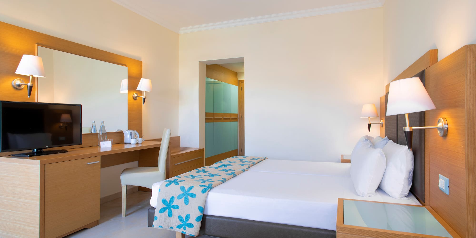 a room with a bed and a desk