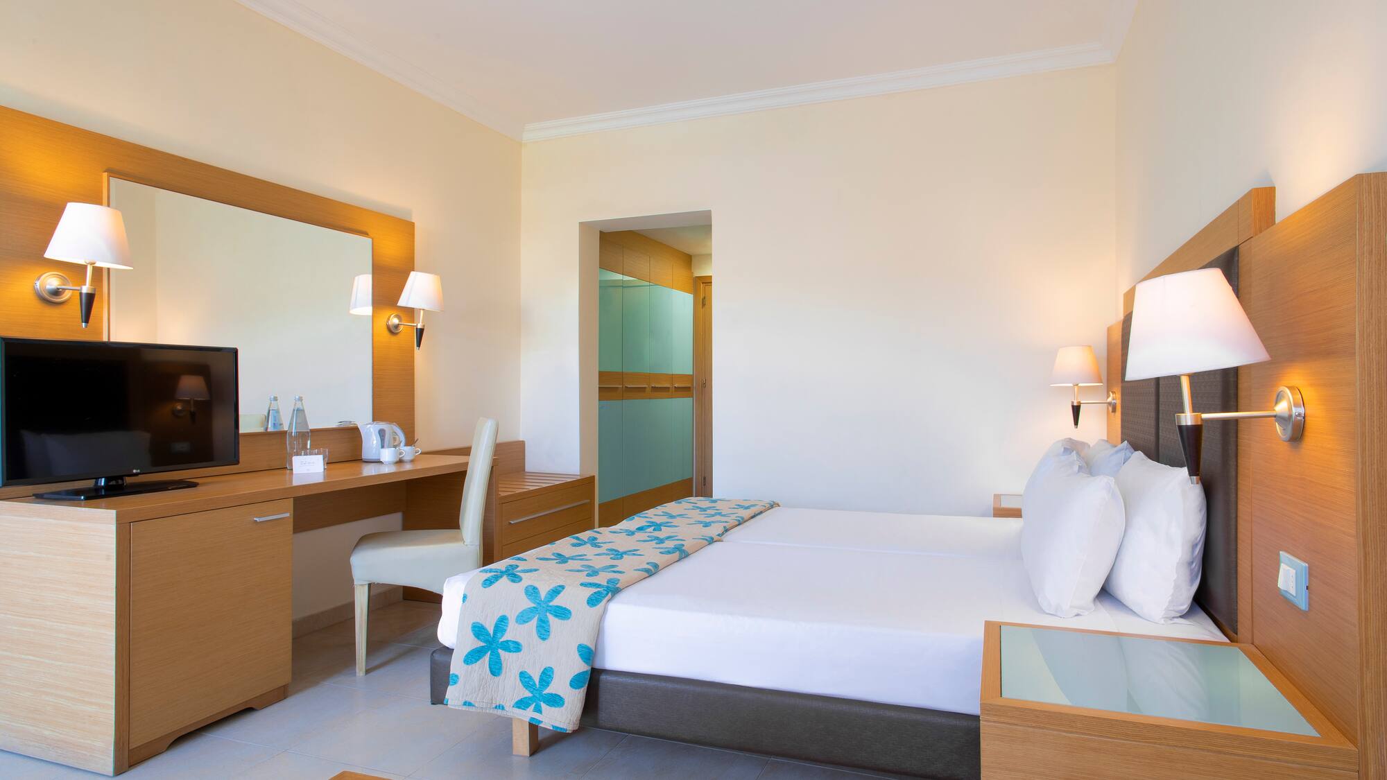 a room with a bed and a desk