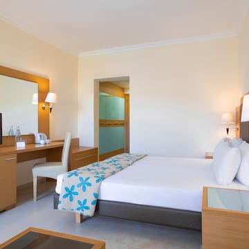 a room with a bed and a desk