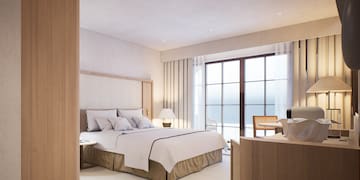 a bedroom with a bed and a table