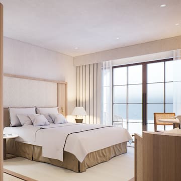 a bedroom with a bed and a table