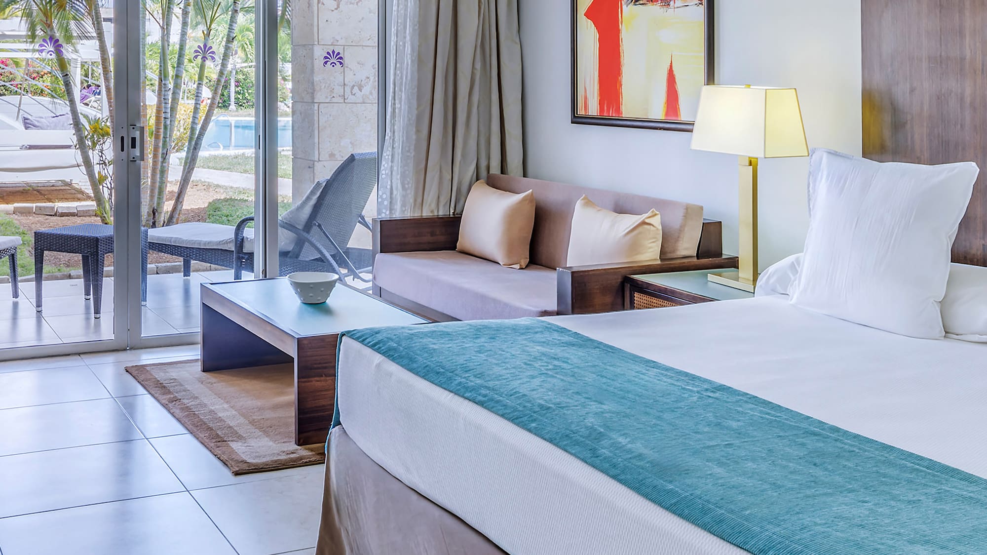 a room with a bed and a glass door