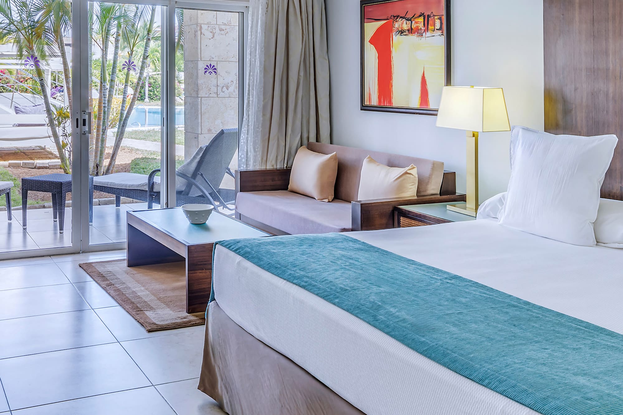 a room with a bed and a glass door