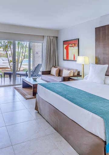 a room with a bed and a glass door