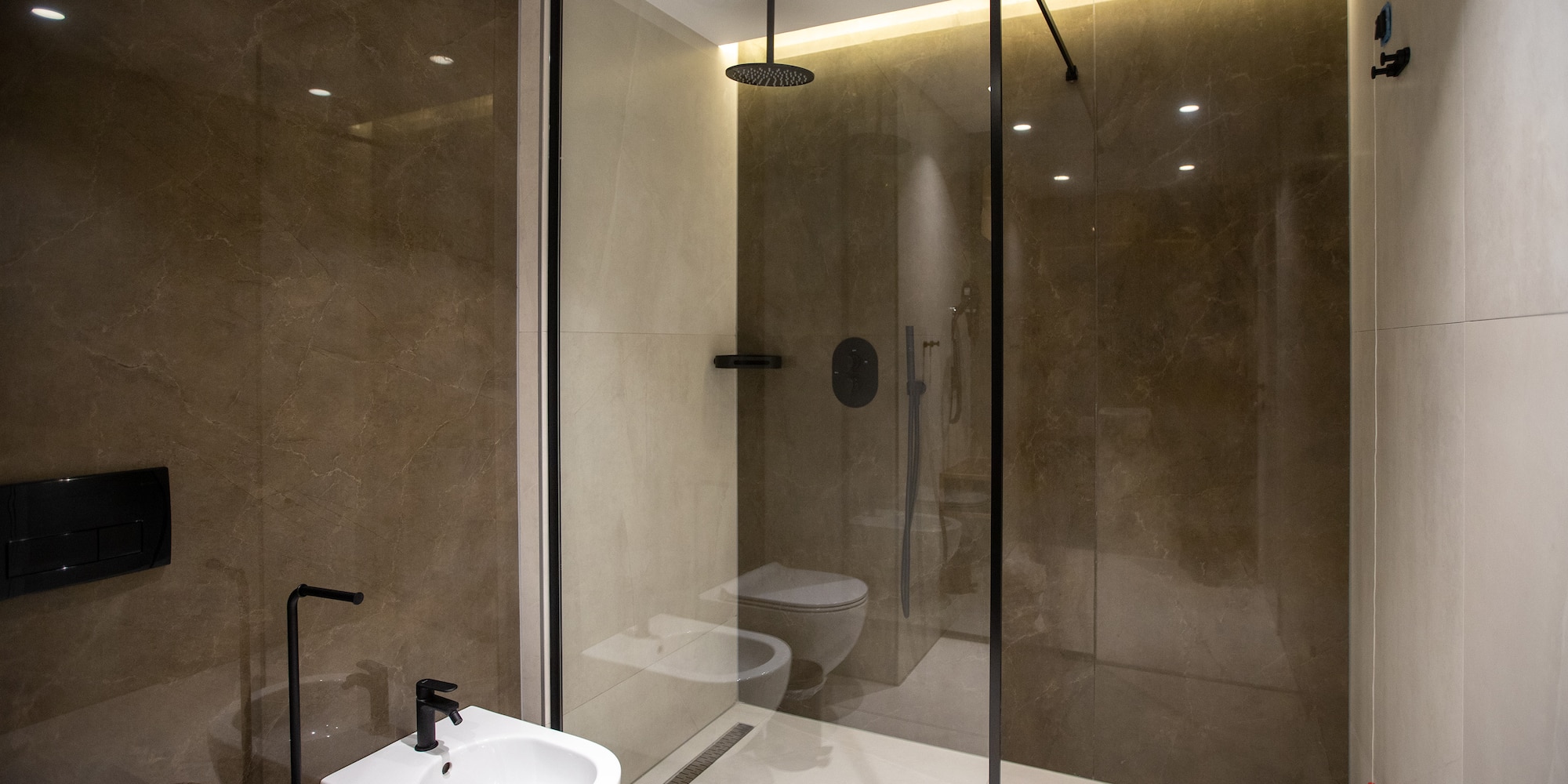 a bathroom with a shower and toilet