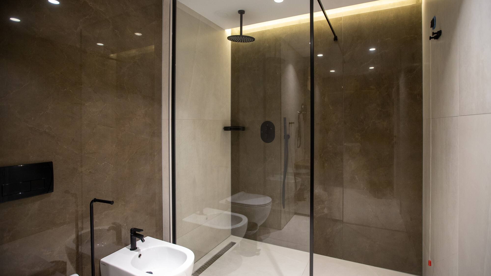 a bathroom with a shower and toilet
