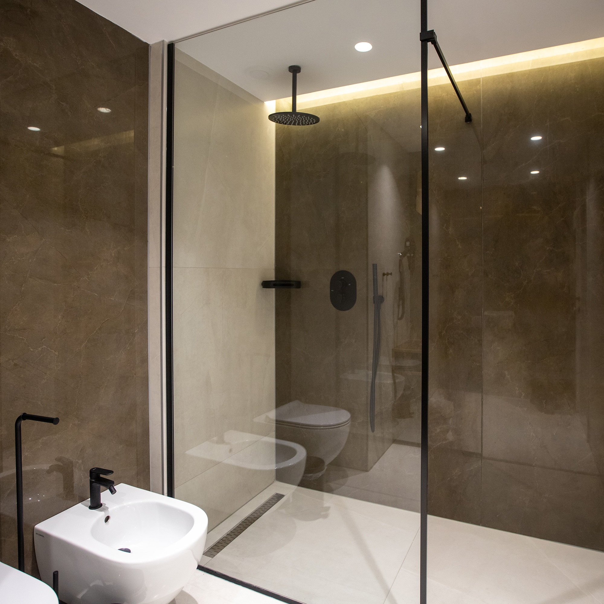 a bathroom with a shower and toilet