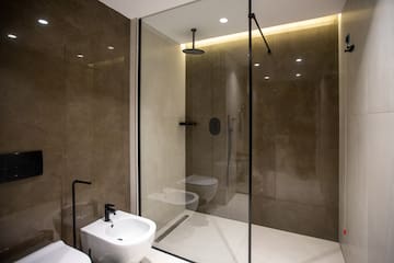 a bathroom with a shower and toilet