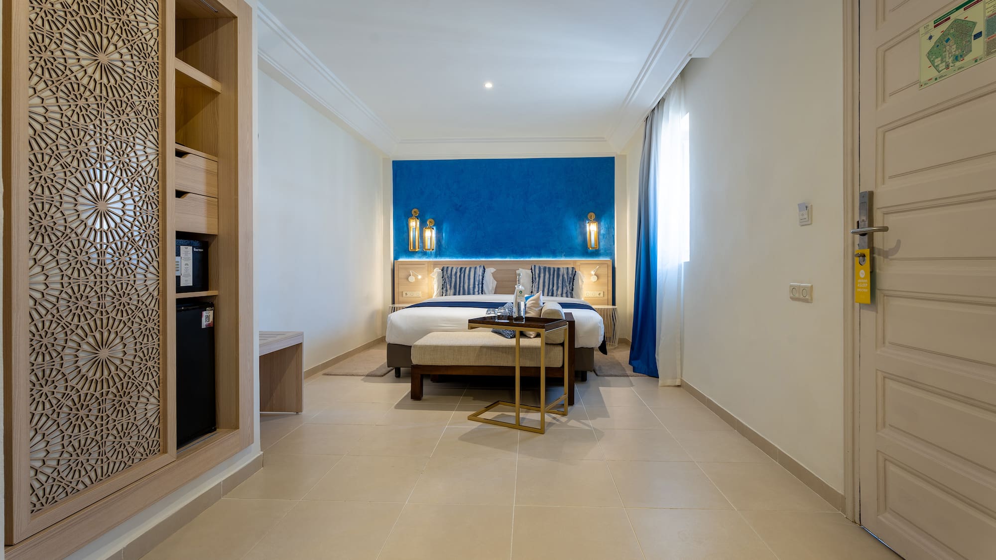 a room with a bed and a bookcase