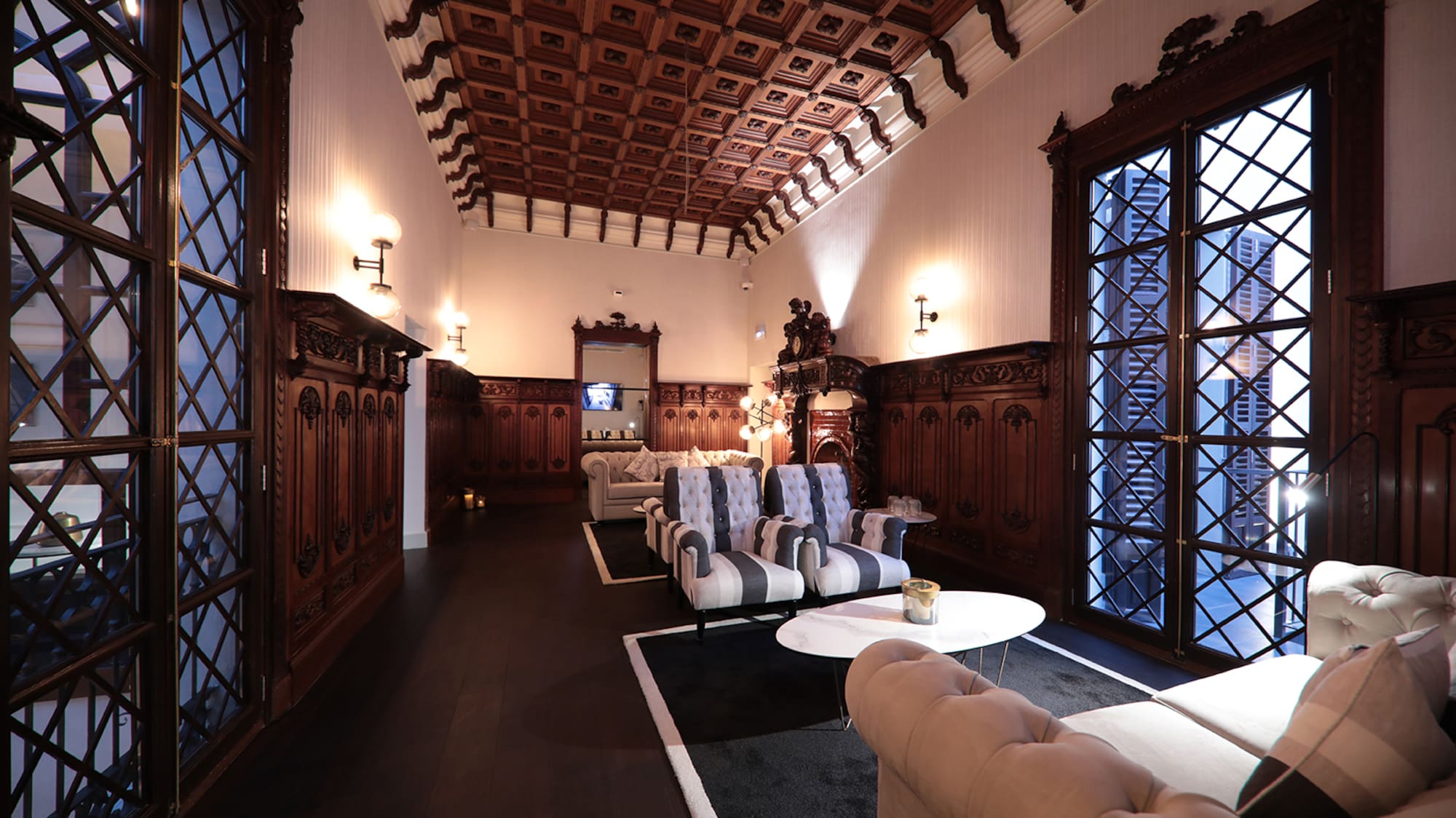 a room with a wood ceiling and a couch and a coffee table
