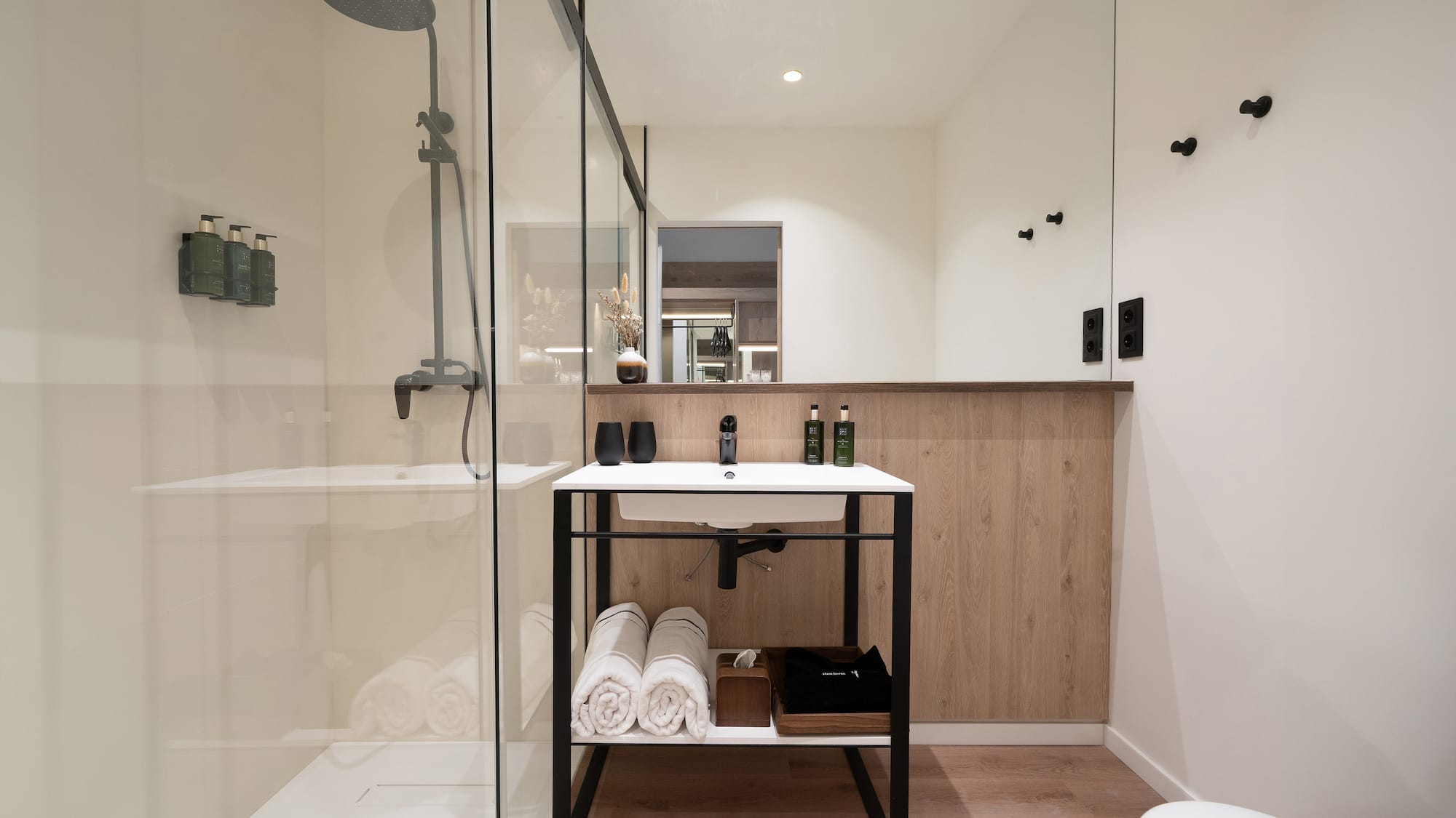 a bathroom with a shower and a sink