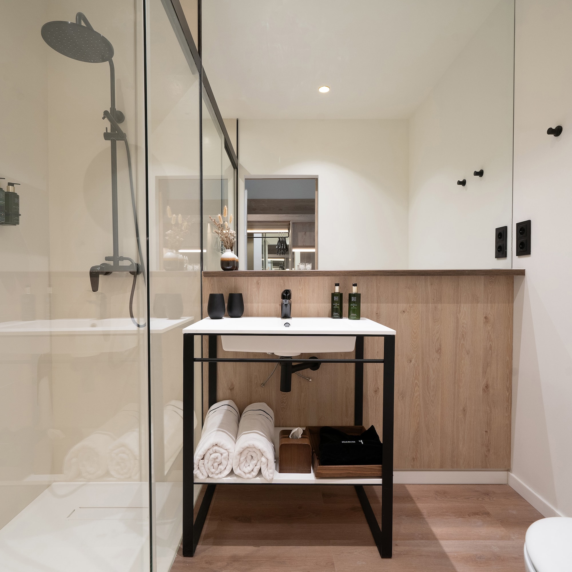 a bathroom with a shower and a sink