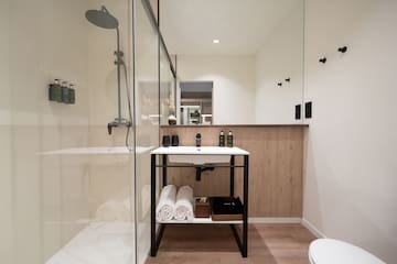 a bathroom with a shower and a sink