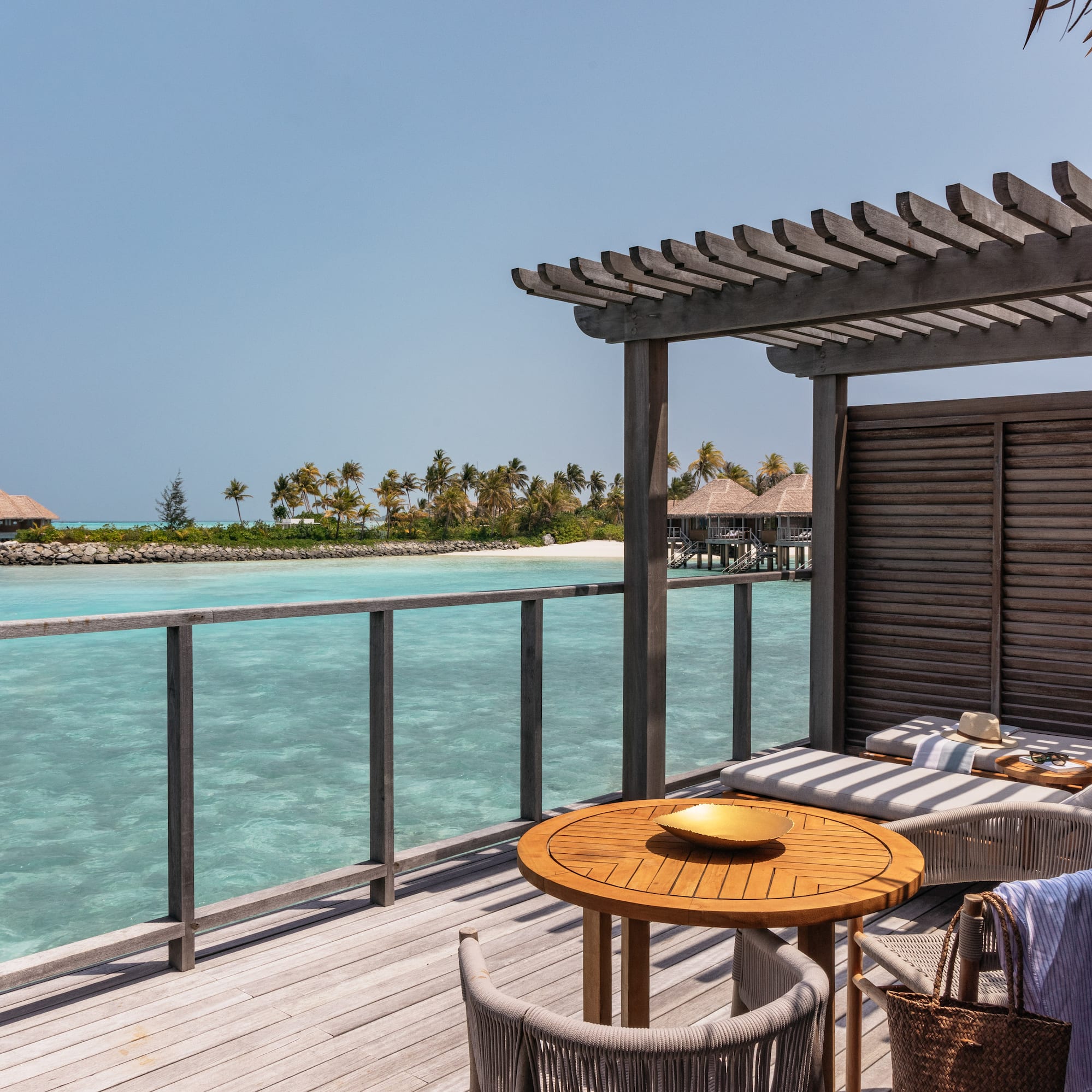 a deck with a table and chairs on it