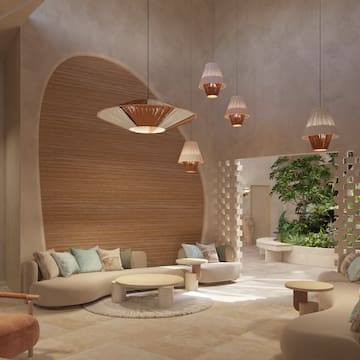 a room with a round table and chairs