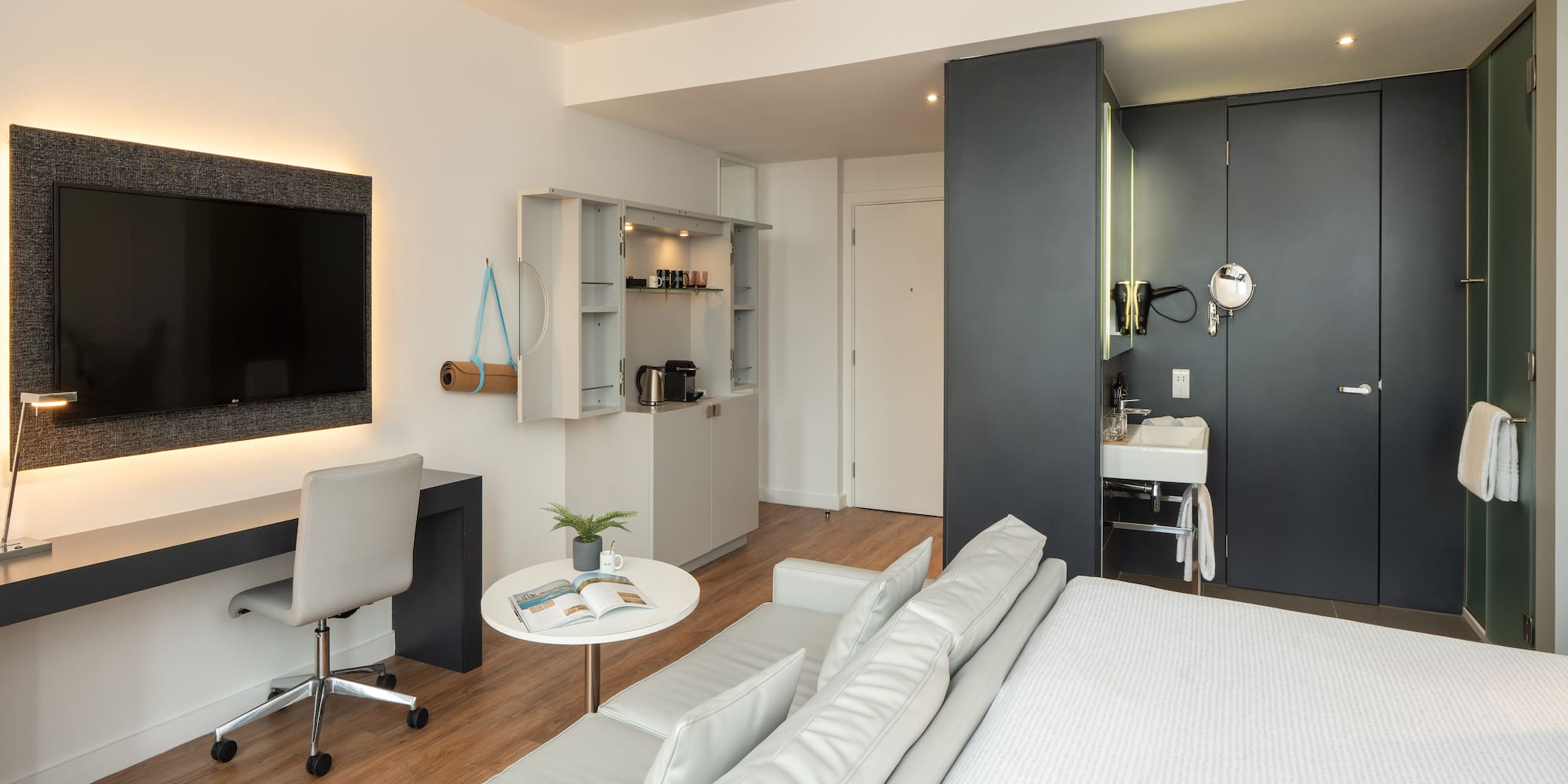 a room with a bed and a tv