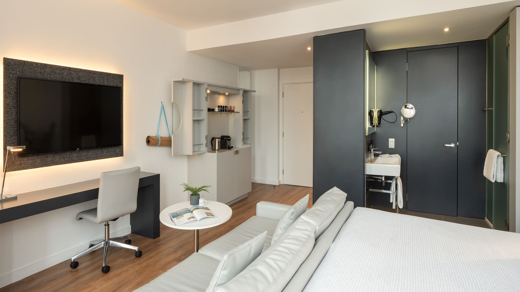 a room with a bed and a tv