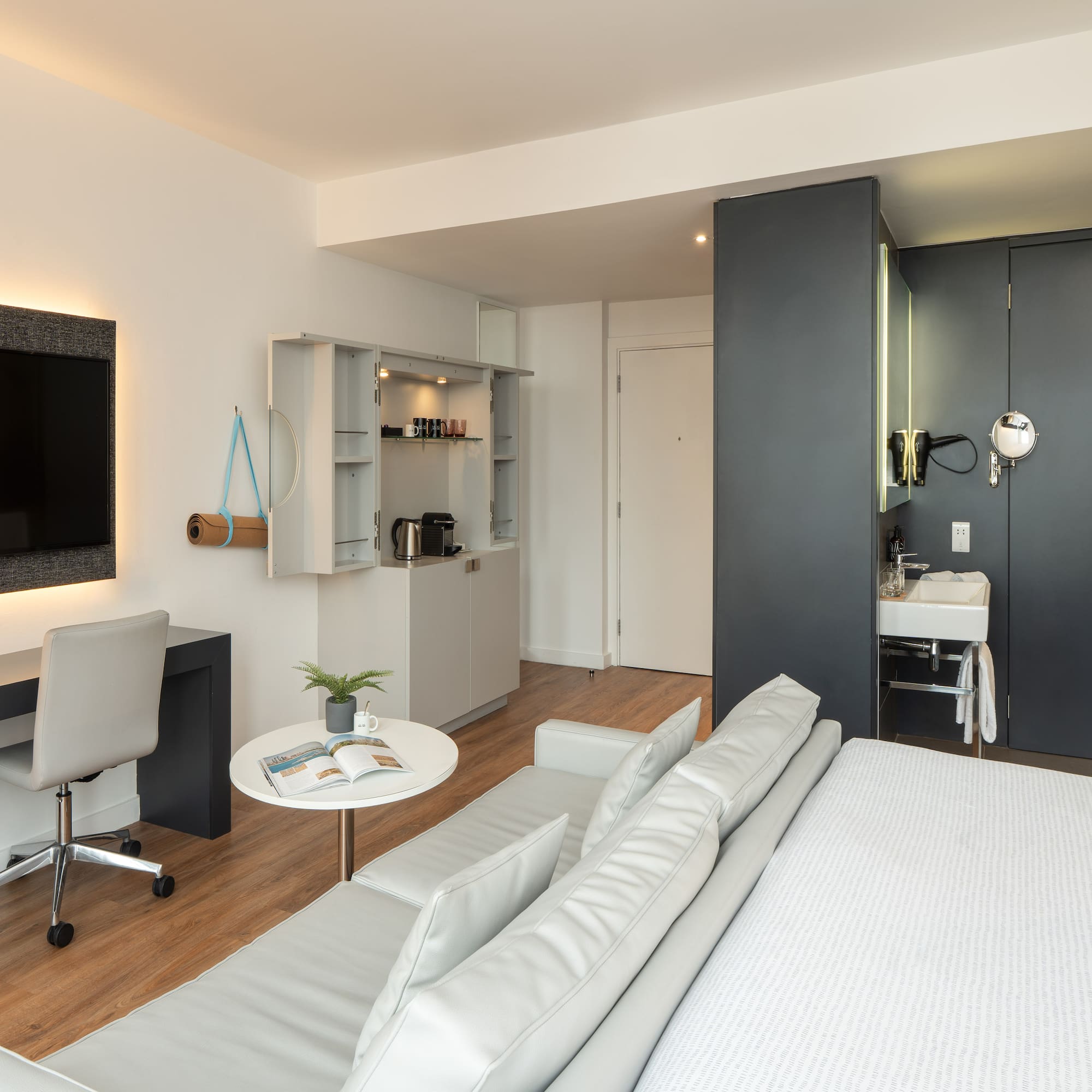 a room with a bed and a tv