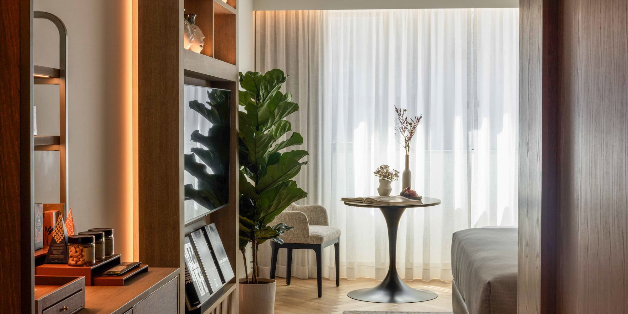 a room with a tv and a table