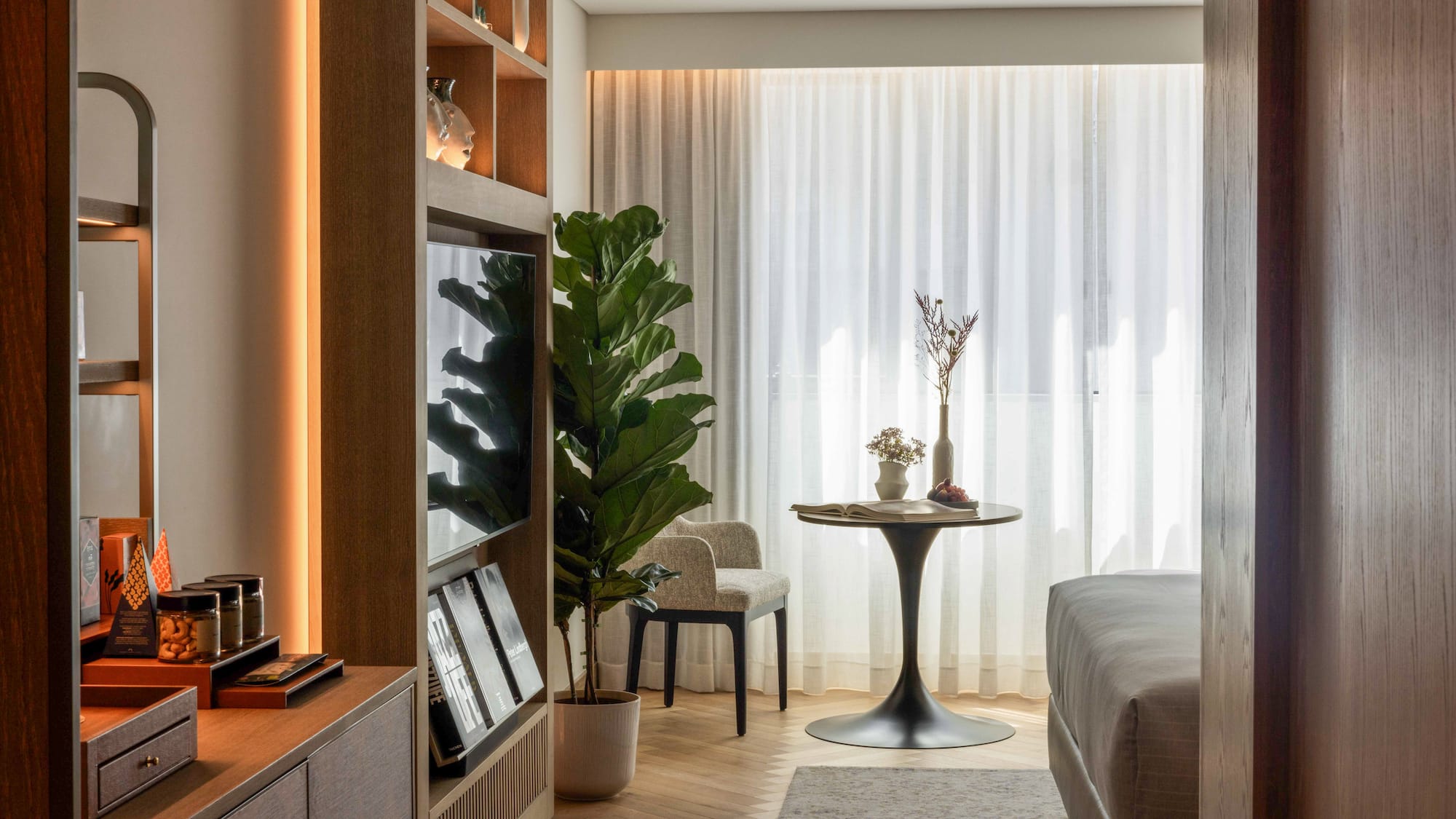 a room with a tv and a table