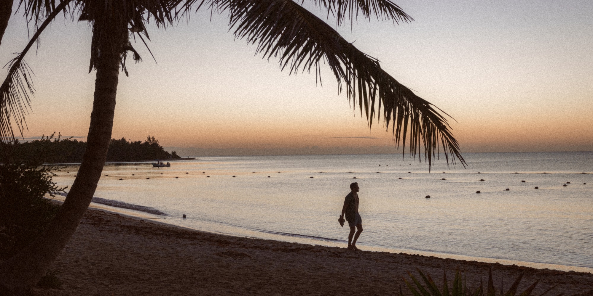 a man walking on a beach