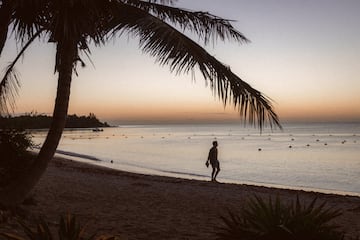 a man walking on a beach