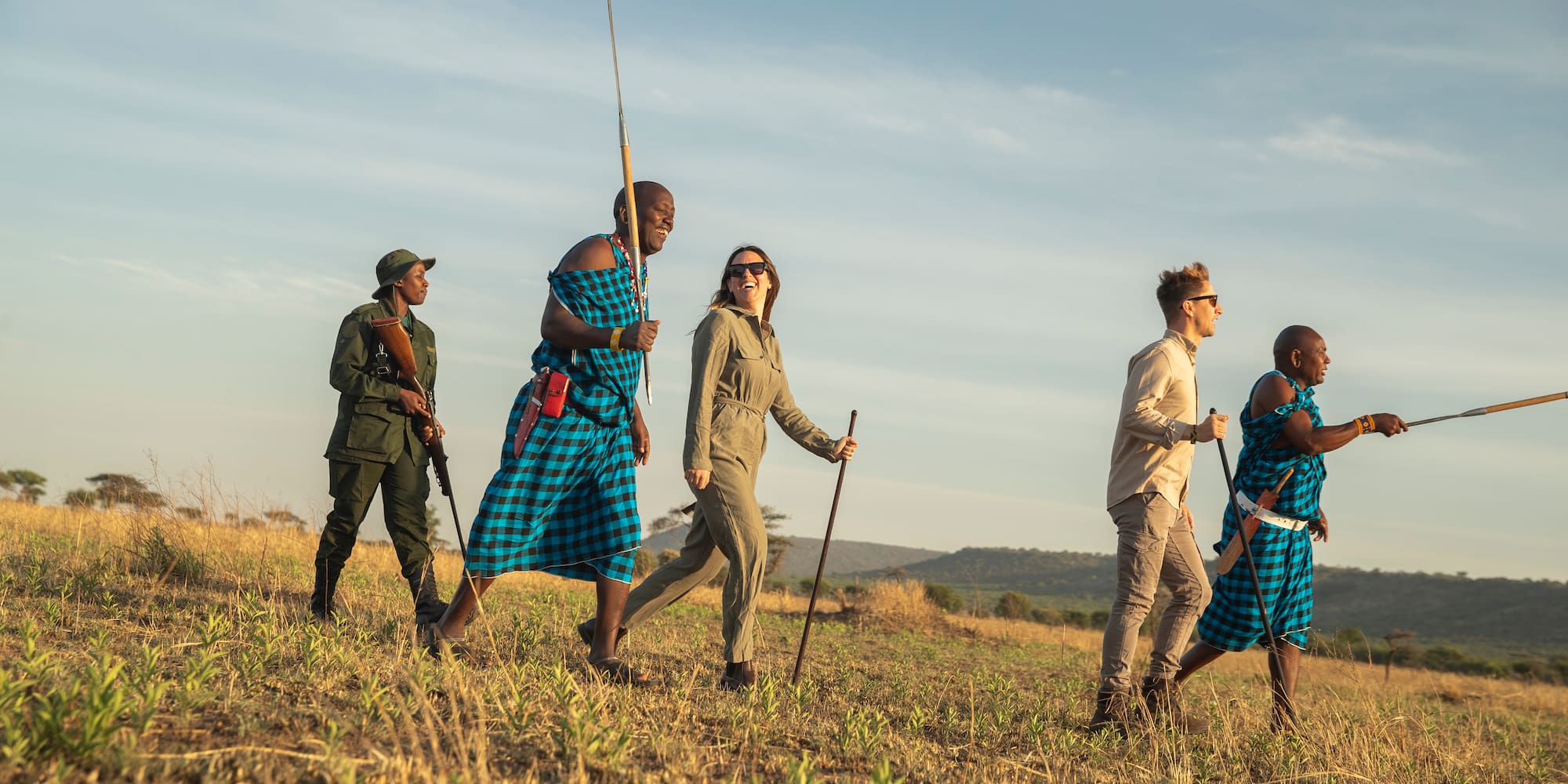 a group of people walking in a field