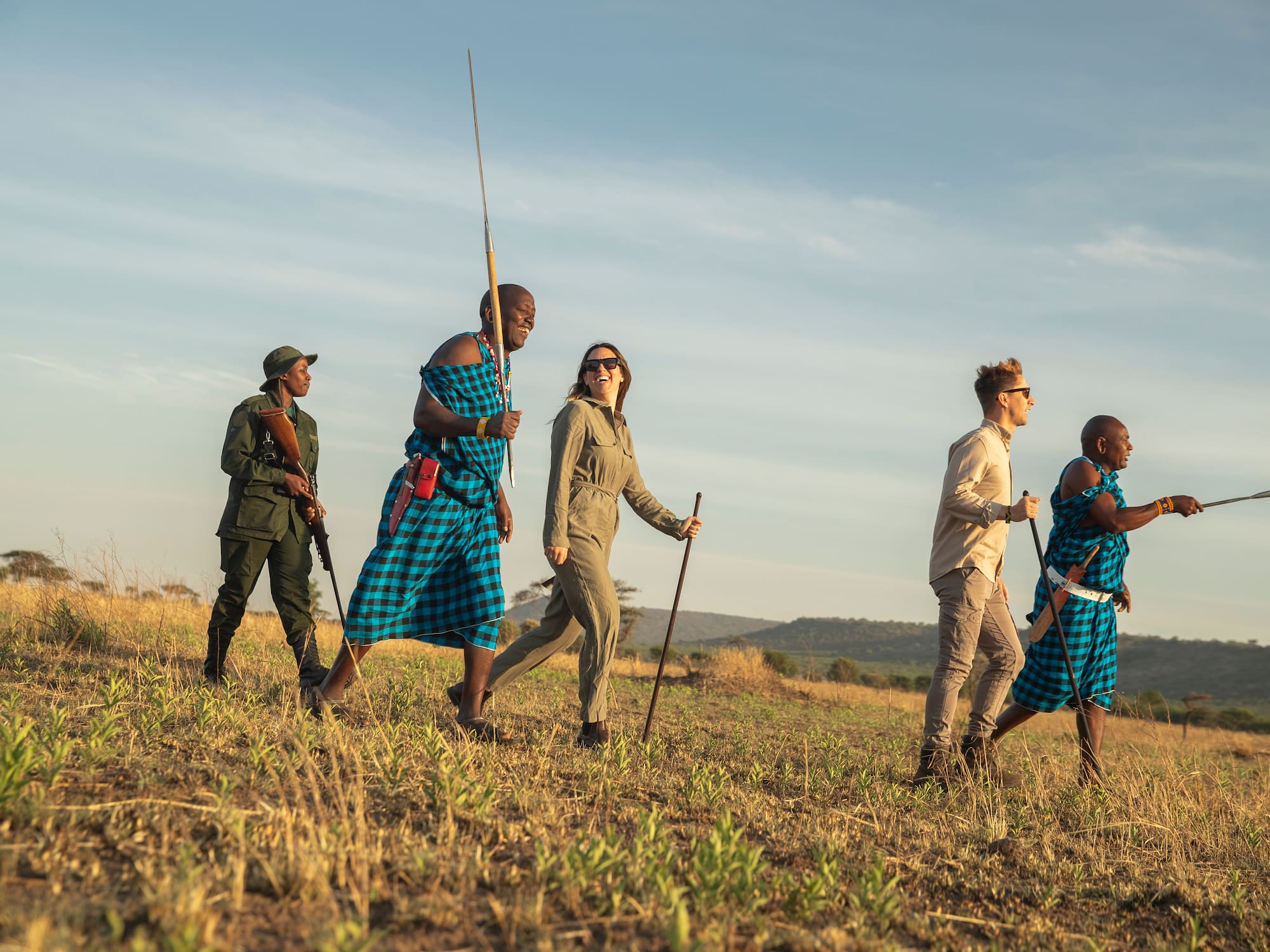 a group of people walking in a field