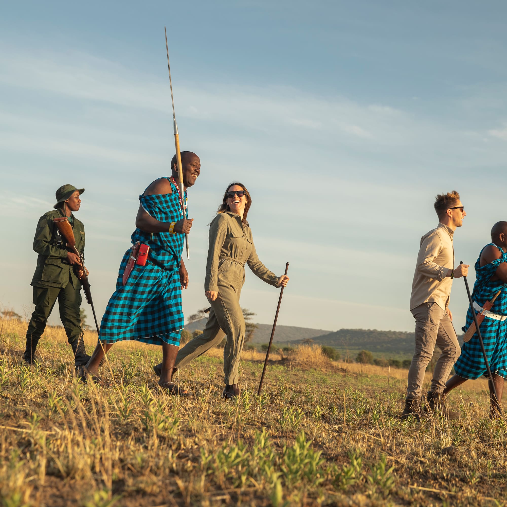 a group of people walking in a field