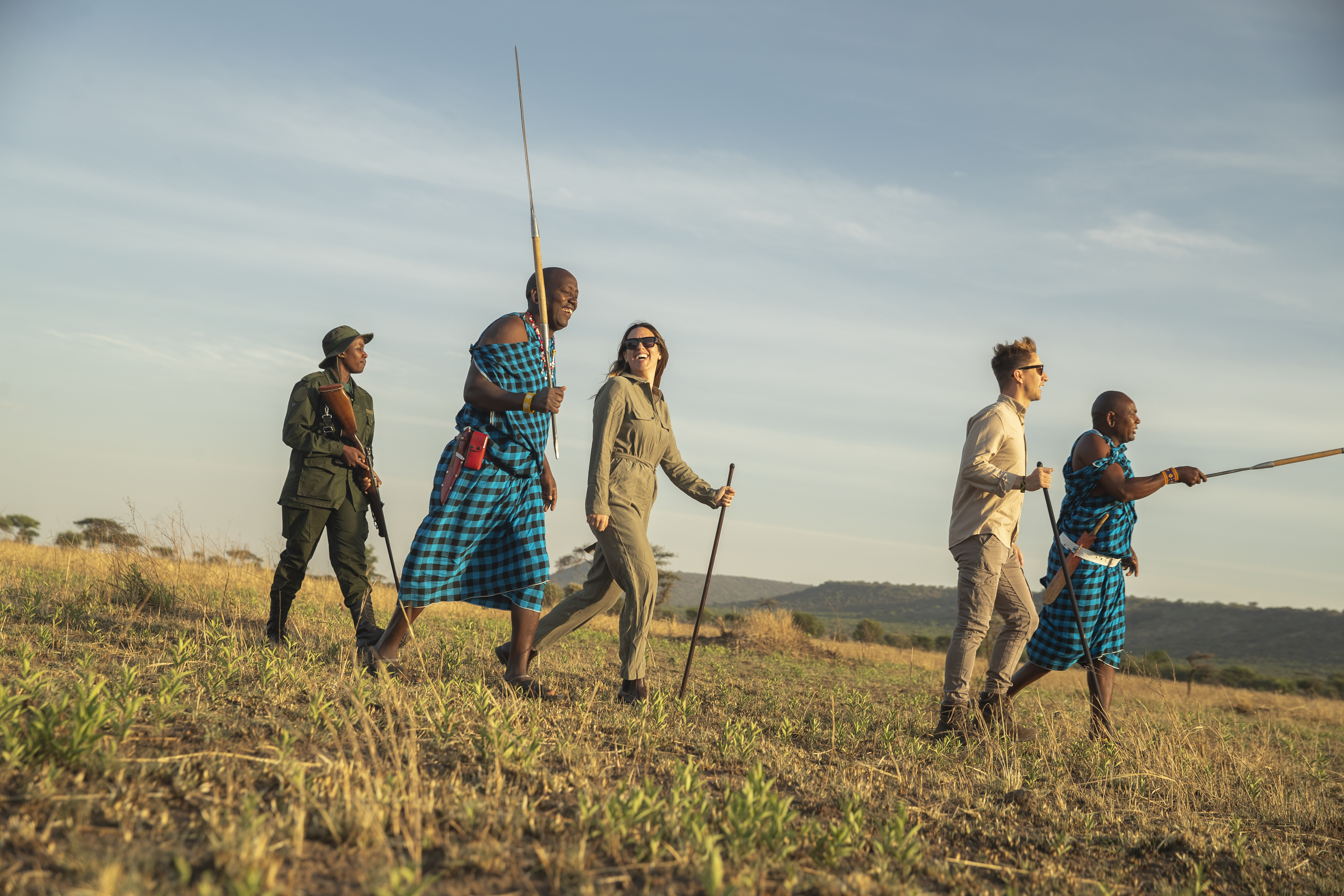 a group of people walking in a field