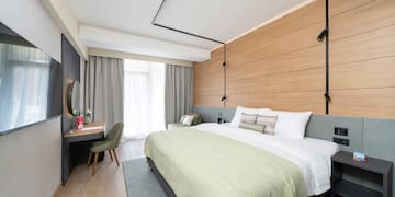 a room with a bed and a desk