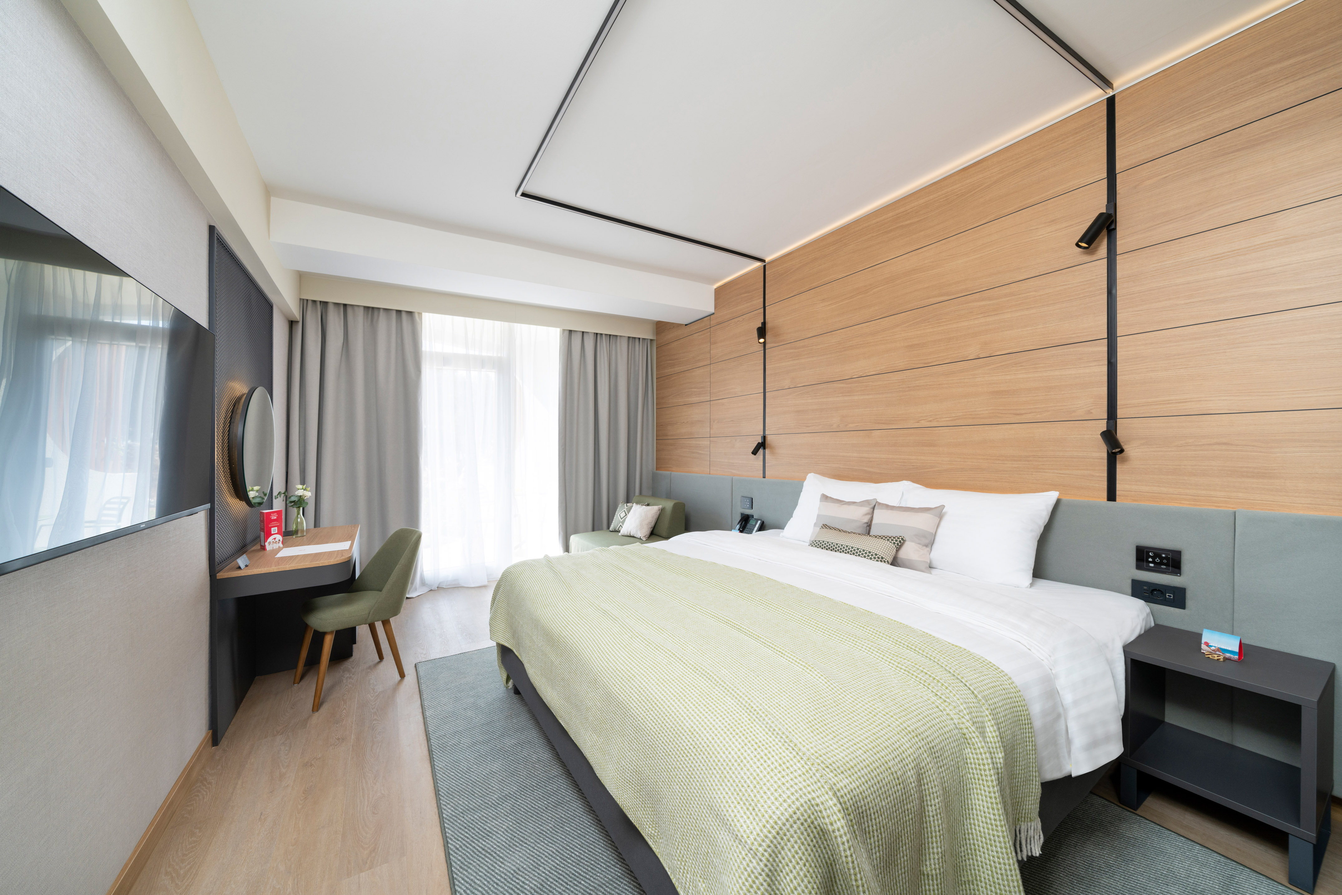 a room with a bed and a desk