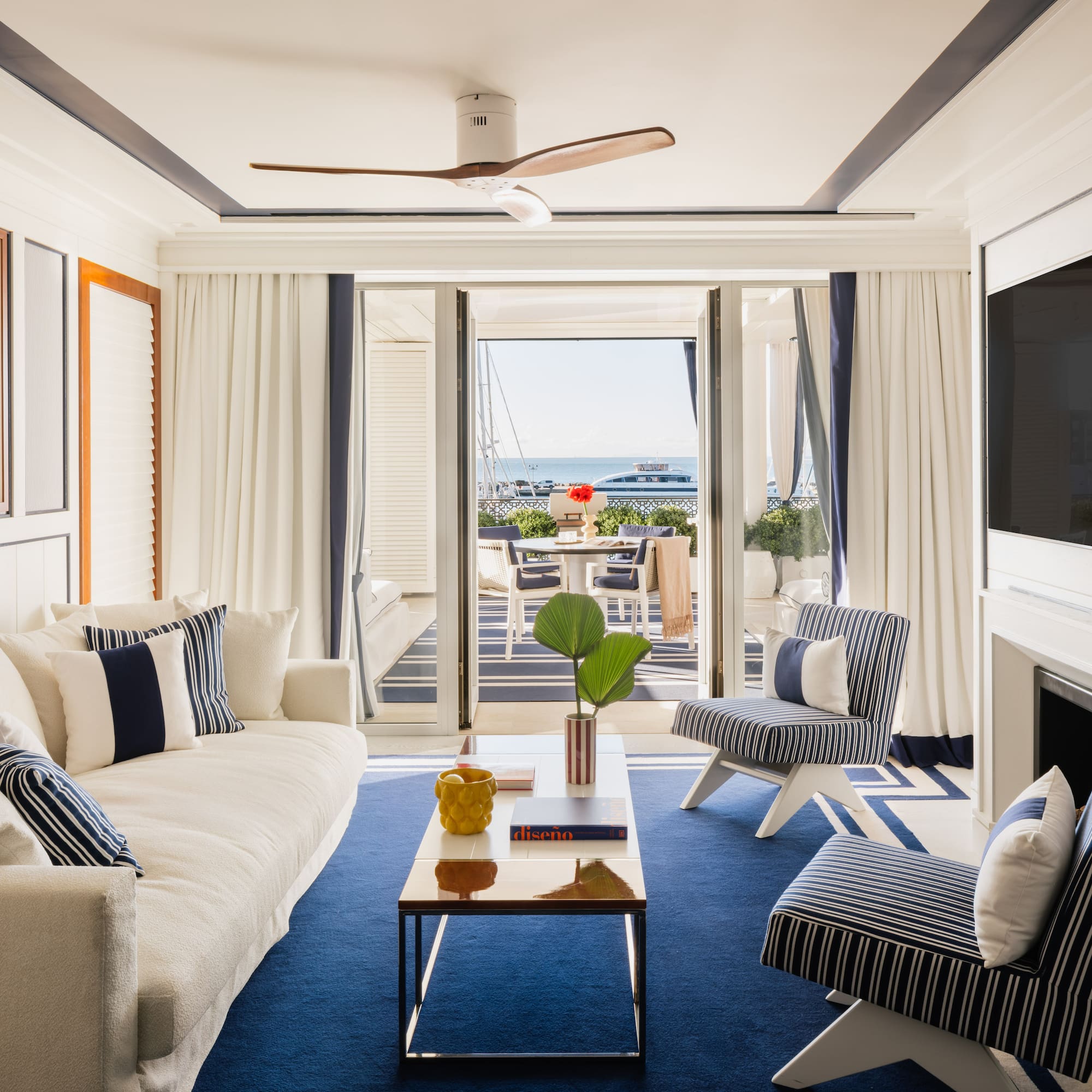 a living room with a television and a fireplace