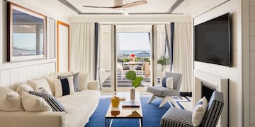 a living room with a television and a fireplace