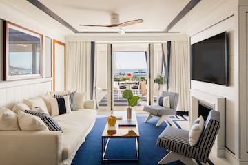 a living room with a television and a fireplace