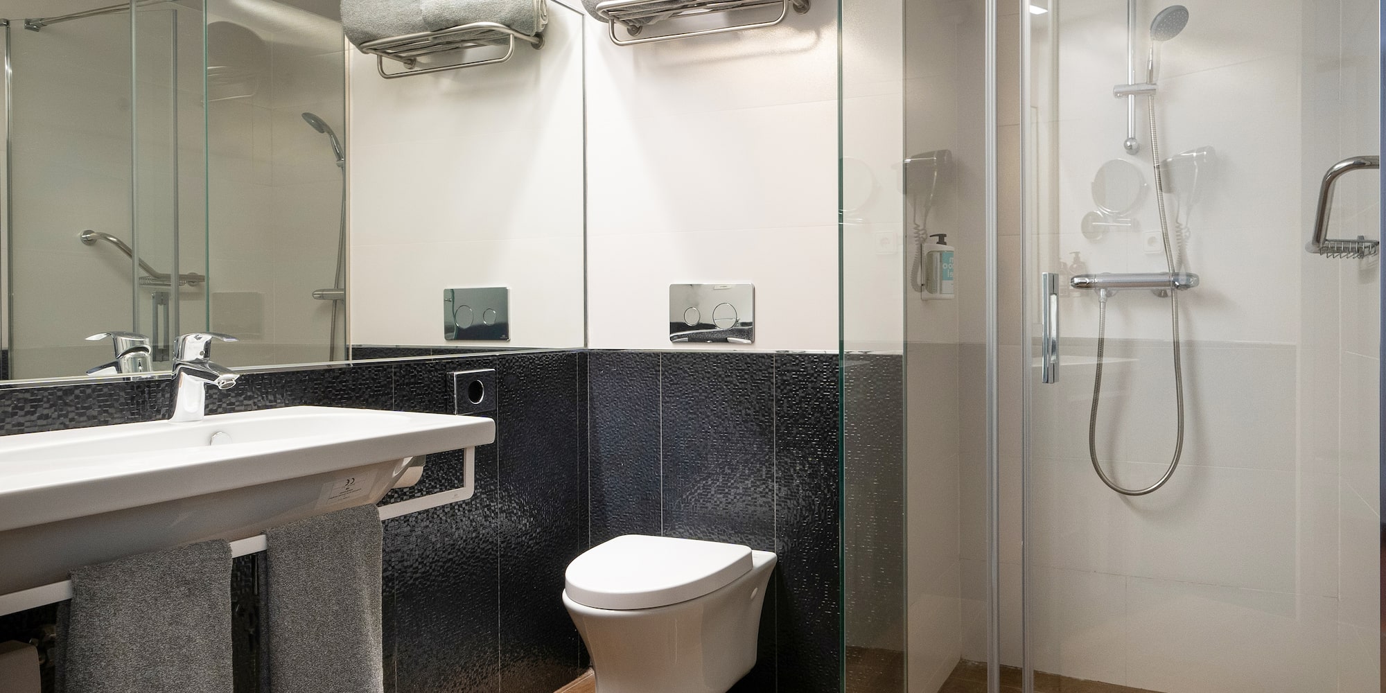 a bathroom with a shower and toilet