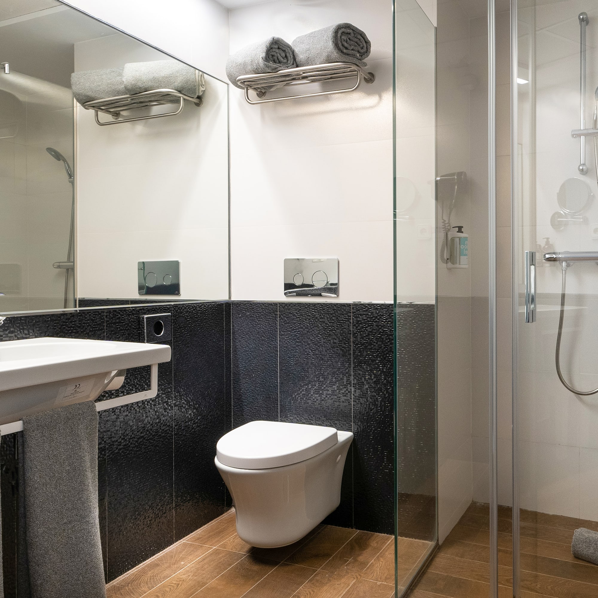 a bathroom with a shower and toilet