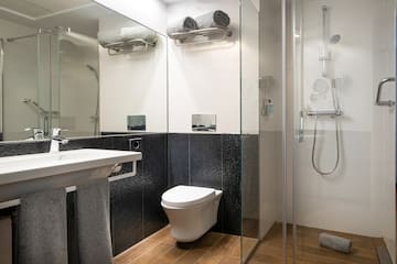 a bathroom with a shower and toilet