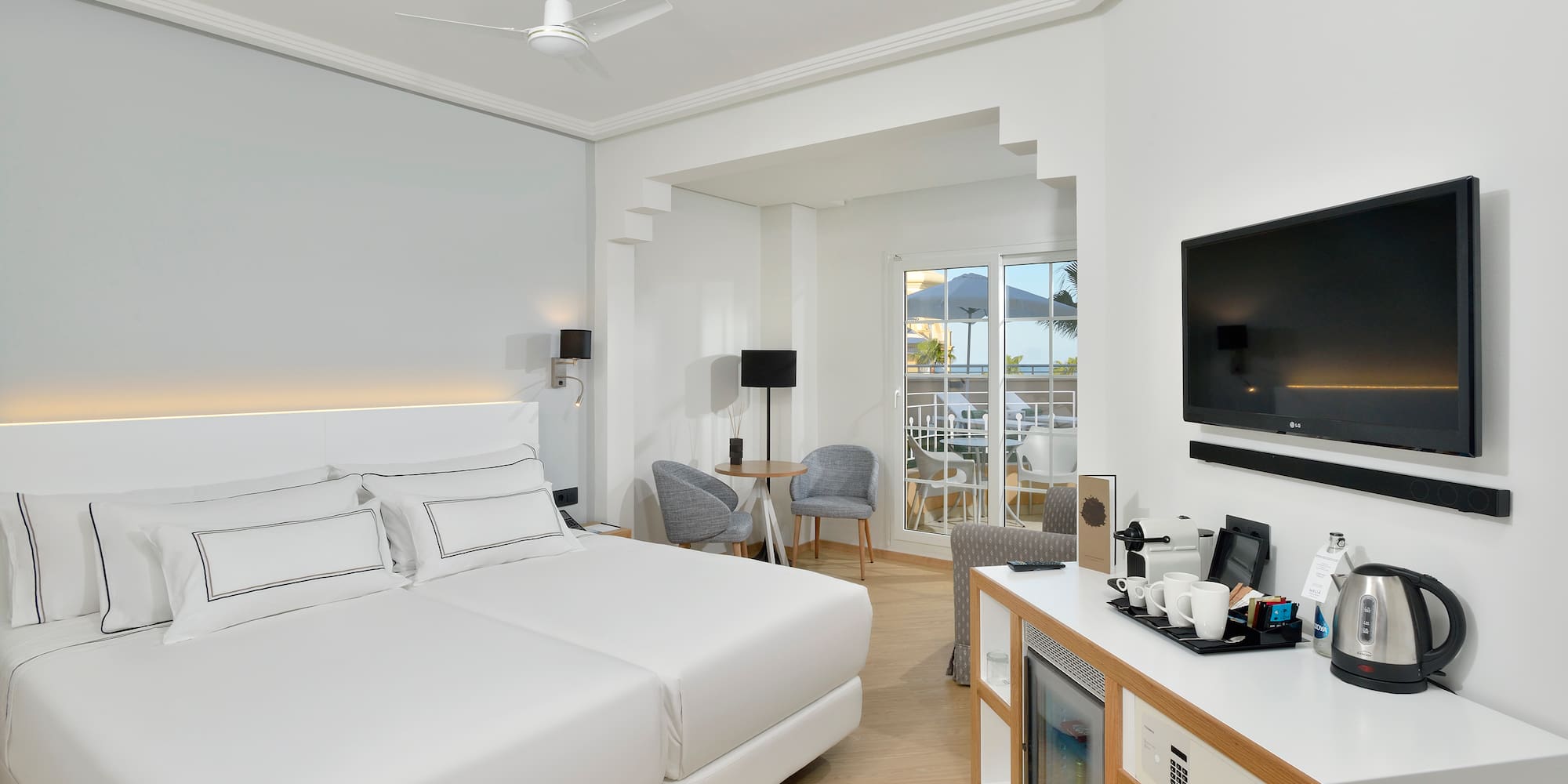 a room with a bed and a television