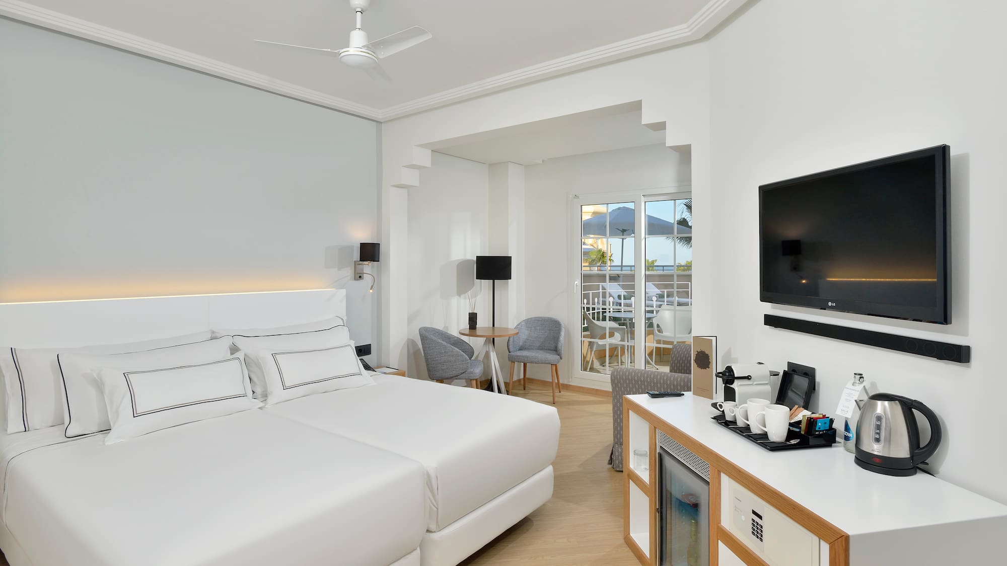 a room with a bed and a television