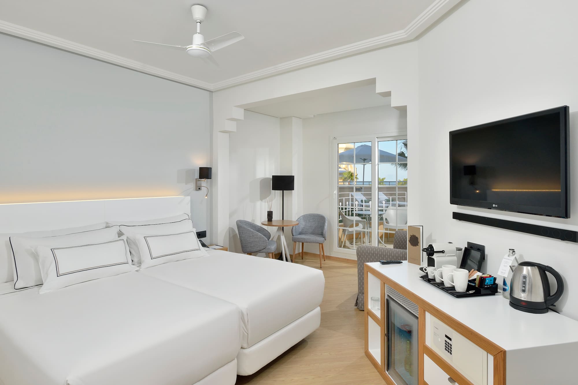 a room with a bed and a television