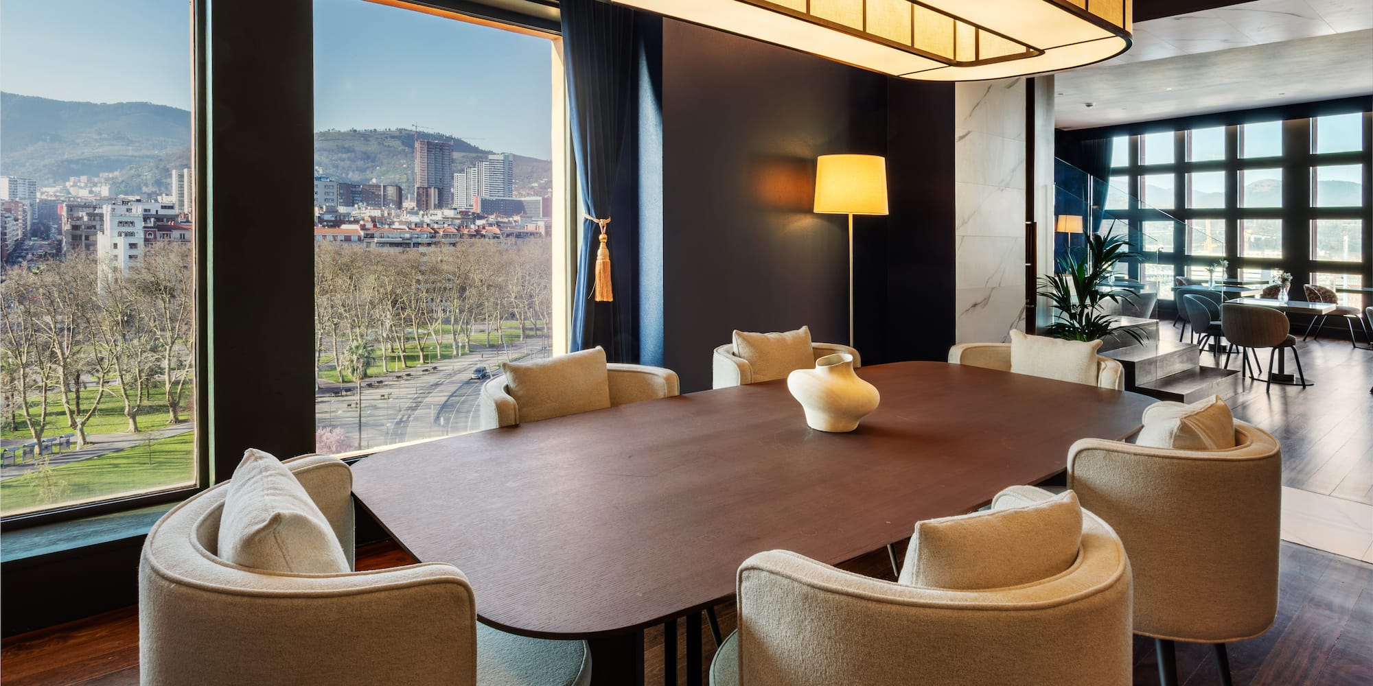 a room with a large table and chairs