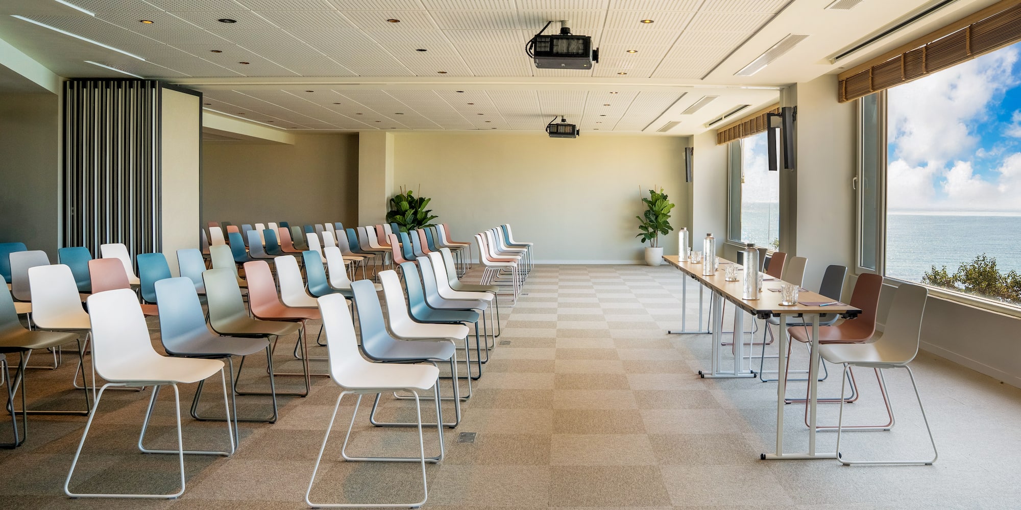 a room with many chairs and tables