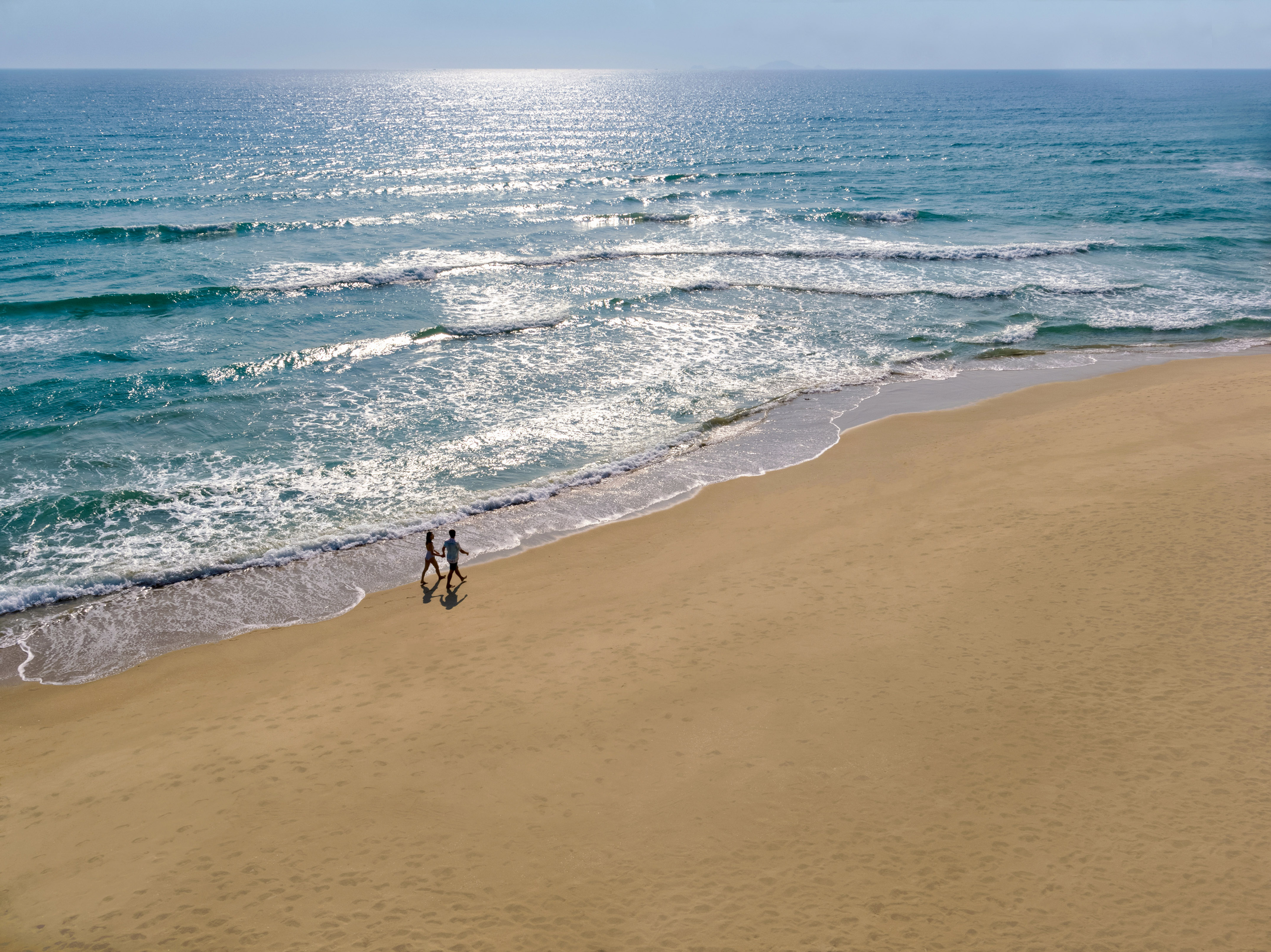 people walking on a beach