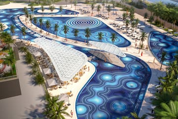 a pool with palm trees and people