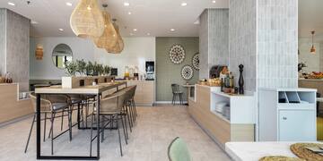 a restaurant with a bar and chairs